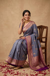 Ganga Ghat ~ Banarasi Pure Katan Silk Saree with Contrast Purple Border In Greyish Blue