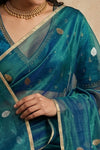 Ganga Ghat ~ Handwoven Banarasi Tissue Silk Saree In Dual Tone Teal Blue
