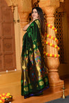 Gaurangi Chandrakor ~ Handloom Pure Silk Maharani Paithani with Majestic Maharani Pallu in Royal Green