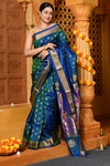 Gaurangi ~ Handloom Pure Silk Maharani Paithani with Majestic Maharani Pallu in Dual Tone Blue Green