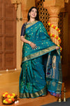 Gaurangi ~ Handloom Pure Silk Maharani Paithani with Majestic Maharani Pallu in Peacock Blue
