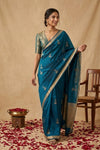 Ganga Ghat ~ Banarasi Pure Handloom Silk Saree with Elegant Silver Zari Buta and Borders In Peacock Blue - verymuchindian.com