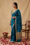 Ganga Ghat ~ Banarasi Pure Handloom Silk Saree with Elegant Silver Zari Buta and Borders In Peacock Blue - verymuchindian.com