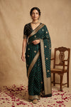 Ganga Ghat ~ Banarasi Pure Organza Saree with Antique Gold Zari Border and Butti Work In Leheriya Black and Forest Green - verymuchindian.com