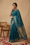 Ganga Ghat ~ Banarasi Pure Soft Silk Saree with Intricate Silver Zari Border and Floral Bird Motifs In Teal Blue - verymuchindian.com