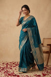 Ganga Ghat ~ Banarasi Pure Soft Silk Saree with Intricate Silver Zari Border and Floral Bird Motifs In Teal Blue - verymuchindian.com