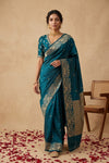 Ganga Ghat ~ Banarasi Pure Soft Silk Saree with Intricate Silver Zari Border and Floral Bird Motifs In Teal Blue - verymuchindian.com