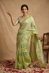 Ganga Ghat ~ Banarasi PureRaw Silk Saree with Silver Zari Stripes and Delicate Floral In Dual - Tone Lime Green - verymuchindian.com