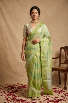 Ganga Ghat ~ Banarasi PureRaw Silk Saree with Silver Zari Stripes and Delicate Floral In Dual - Tone Lime Green - verymuchindian.com