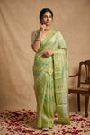 Ganga Ghat ~ Banarasi PureRaw Silk Saree with Silver Zari Stripes and Delicate Floral In Dual - Tone Lime Green - verymuchindian.com