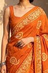 Krutikari – Viscose Saree with Handcrafted Batik Work in Sapphire Orange - verymuchindian.com