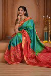 Shubh Lakshmi ~ Handloom Pure Silk Ikkat Patola Saree in Dual Tone Green and Red (Silk Mark Certified)