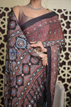 Shubh Lakshmi 2.0 ~ Exclusive Designer Ajrakh Handblock Hand-stitched Mirror Work Modal Silk Saree in Black and Brown - verymuchindian.com