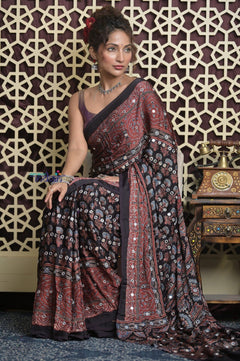 Shubh Lakshmi 2.0 ~ Exclusive Designer Ajrakh Handblock Hand-stitched Mirror Work Modal Silk Saree in Black and Brown - verymuchindian.com