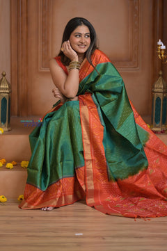 Shubh Lakshmi ~ Handloom Pure Silk Ikkat Patola Saree in Dark Green and Roughe Red (Silk Mark Certified) - verymuchindian.com