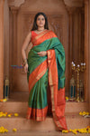 Shubh Lakshmi ~ Handloom Pure Silk Ikkat Patola Saree in Dark Green and Roughe Red (Silk Mark Certified) - verymuchindian.com