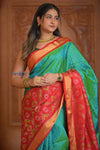 Shubh Lakshmi ~ Handloom Pure Silk Ikkat Patola Saree in Dual Tone Green and Red (Silk Mark Certified) - verymuchindian.com