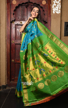 Rajsi~ Pure Silk Handloom Maharani Paithani in Turquoise Blue with a Vibrant Green & Golden Pallu.