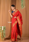 Pehal~ Handloom Pure Silk Maharani Paithani in Flaming Red with Chakra buttis and Peacock Pallu.